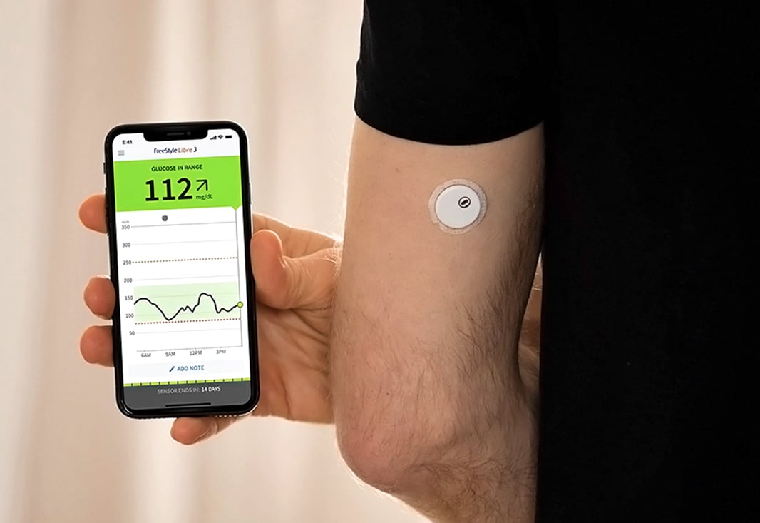 A FreeStyle Libre continuous glucose monitor and reader